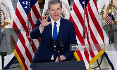 North Carolina Governor Roy Cooper speaks during a visit by US Vice President Kamala Harris to Guilford Technical Community College in Greensboro, North Carolina, April 19, 2021. (Photo by SAUL LOEB / AFP) (Photo by SAUL LOEB/AFP via Getty Images)