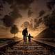 father and son, walking, railway